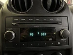 09 10 Jeep Compass Radio Am-fm-cd Face Plate Id Res **may Need Programming**. Fixed Price $74.59.